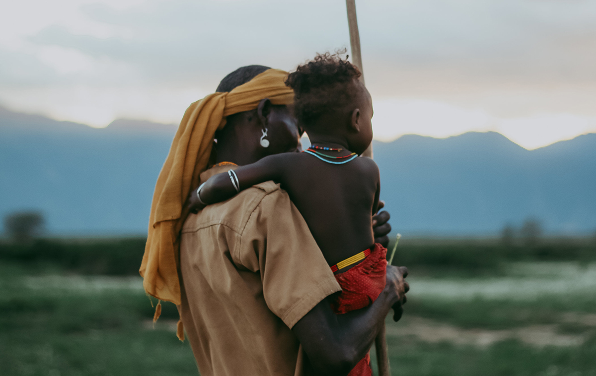 Man and child looking at a distance.